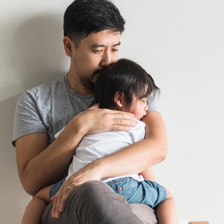 Father holding daughter c